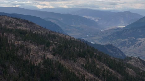 Aerial-Scenery-of-Ashcroft,-British-Columbia's-Natural-Environment:-Untouched-Forests-and-Semi-Arid-Desert-on-a-Cloudy-Day