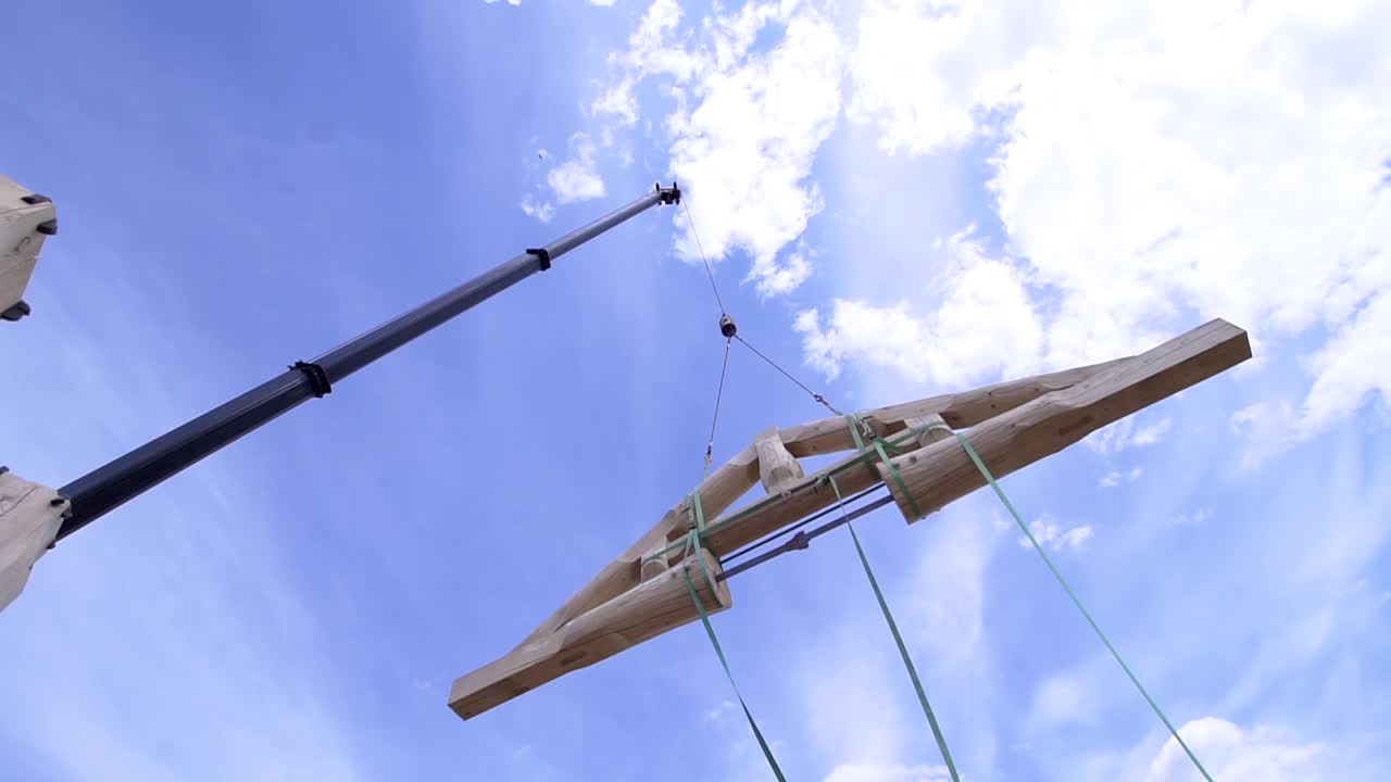 Crane Lifting Wooden Roof Truss