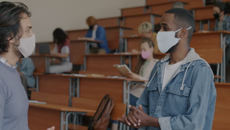 students talking in a classroom during a pandemic
