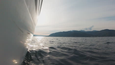 boat sailing in calm waters, sunny day