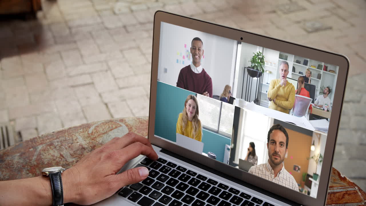 Man having a video conference with multiple people