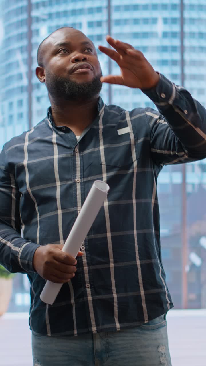 Black Man Talking and Gesturing in a Modern Office