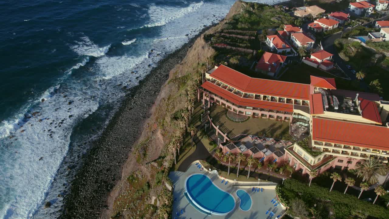 Aerial view of a hotel and resort on a coastal cliff