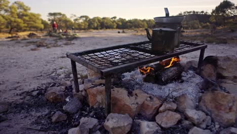 billy tea boiling on a campfire in outback australia