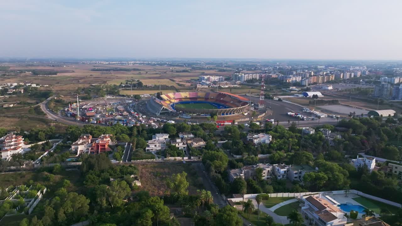 Impressive 4K drone footage of a football stadium from above, showcasing its full structure and field
