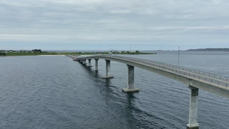 giske bridge outside alesund norway - forward moving aerial beside bridge with gjerdesanden beach in background