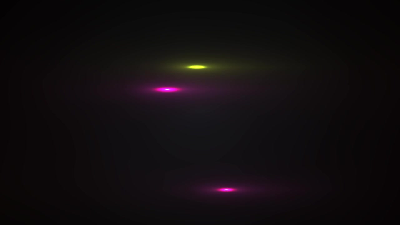 Bagliori di Luce Colorati Dinamici in Movimento su Sfondo Nero