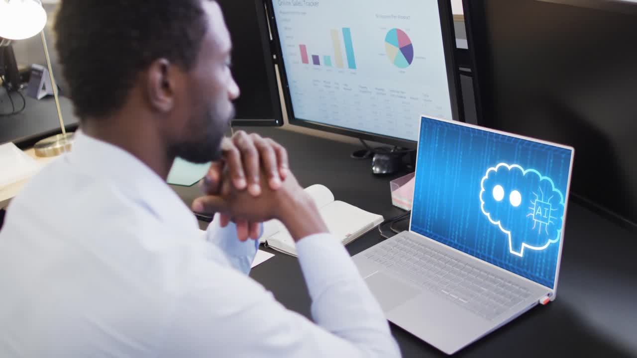 Composition of african american businessman using laptop with ai chat on screen