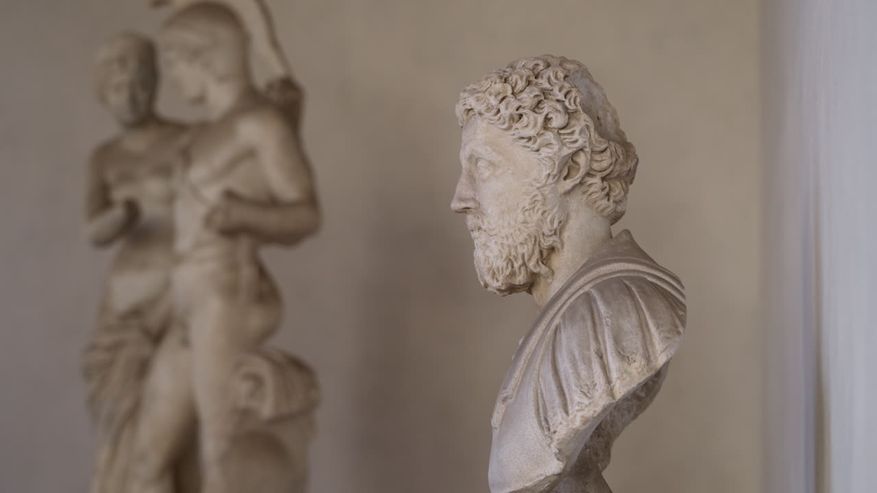 Tilt up shot of Roman sculpture and bust of Marcus Aurelius, the emperor of ancient Rome and philosopher king. Rome, Italy,