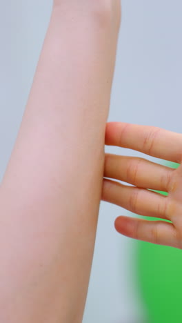 close-up of a workout session showing one person holding another's hand, assisting during an exercise, emphasizing teamwork and support in a fitness environment
