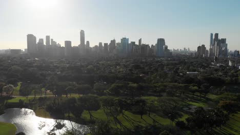 manila city skyline and lush green park - aerial view