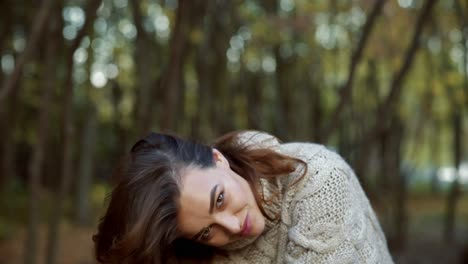 sunny autumn day in park. young woman spending time in autumn park