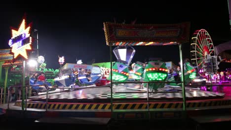 Empty Spinning Amusement Park Ride Lighted In The Evening In Szczecin Poland- medium shot