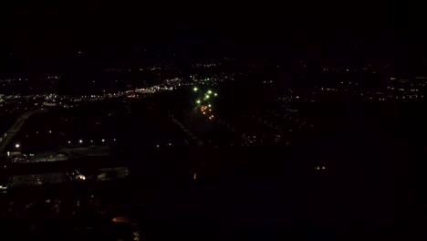 aerial shot of fireworks with city lights in the background.  city night lights.  4k footage.