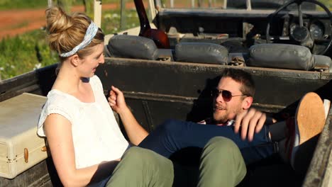 couple interacting while relaxing in car 4k