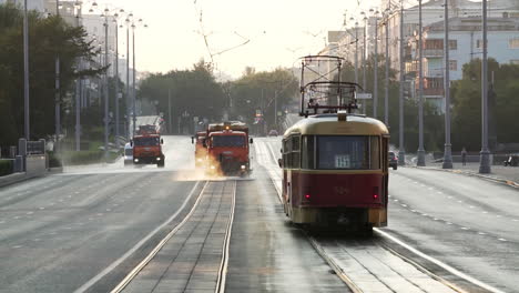 street cleaning and tram in the city