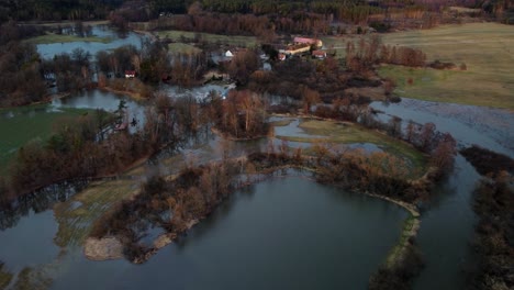 a flooded landscape with an old settlement