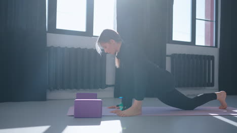 woman doing yoga workout in gym