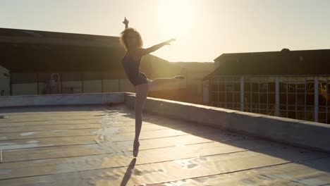 ballet dancer practicing on rooftop