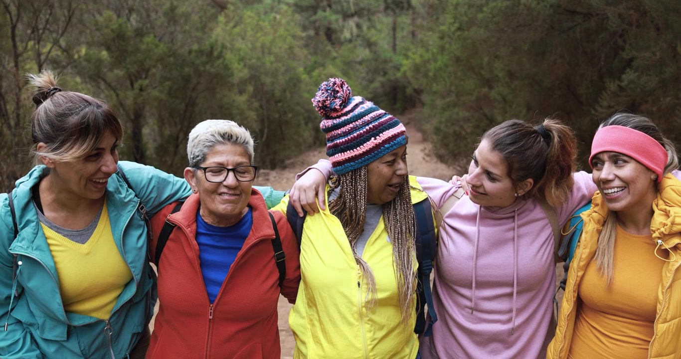 Group of Diverse Women Hiking Together in Forest