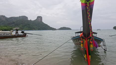 boats anchored on a scenic thai beach