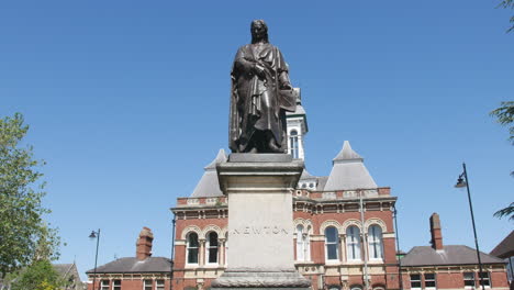 sir isaac newton statue on a summer day