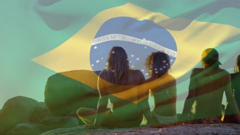 Animation-of-flag-of-brazil-over-diverse-group-of-friends-at-beach