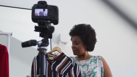 African-american-female-plus-size-vlogger-recording-a-video-about-fashion