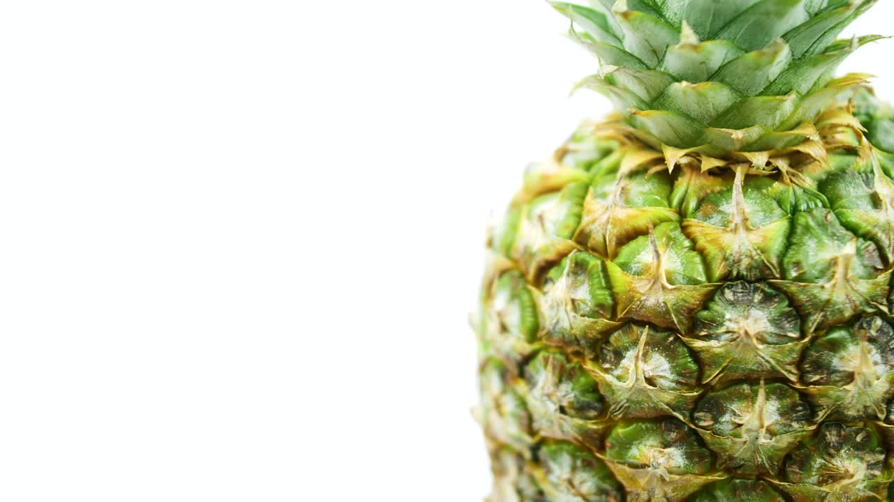 Rotating pineapple footage, Pineapple spinning on a white background.