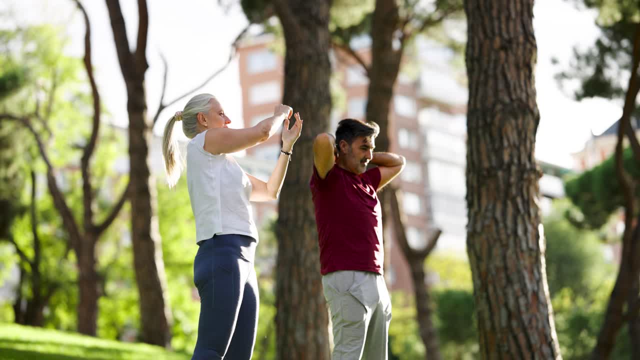 Couple Stretching in the Park