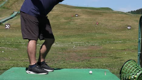 man practicing golf swing in piedmont, italy