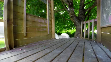 boy walking up the slide and playing with toy gun 4k