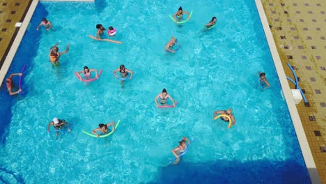 odessa, ukraine - august 2017: people doing water aerobics in the hotel pool.