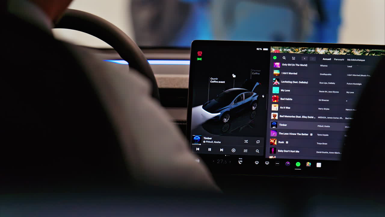 Cannes, France - February 15, 2025: Close up of the steering wheel in the inside of a car with a big screen