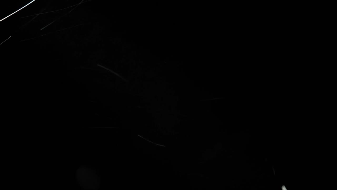 Abstract White Light Trails Moving on Dark Background