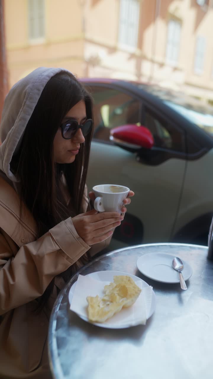 Woman enjoying coffee and snack outdoors