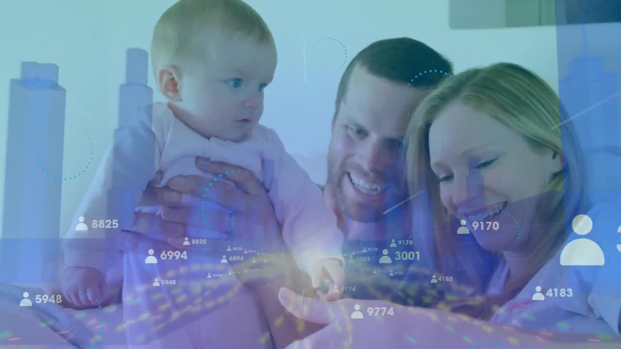 우리는 침실에서 아기와 함께 재미있는 백인 어머니와 아버지를 볼 수 있습니다.