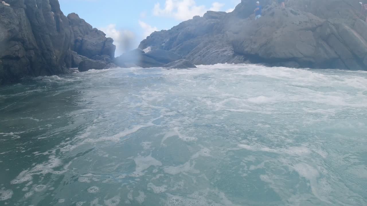 under the surface of the famed Bubbly Pool, on Jost Van Dyke, British Virgin Islands