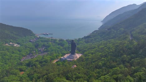 aerial photography of the statue of laozi in taiqing palace, laoshan mountain, qingdao, china. the statue of laozi, the founder of chinese taoism,