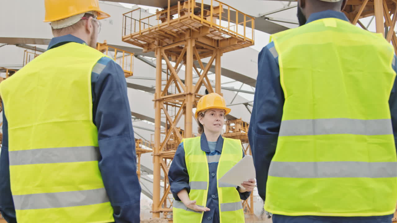 Construction Forewoman Giving Instructions