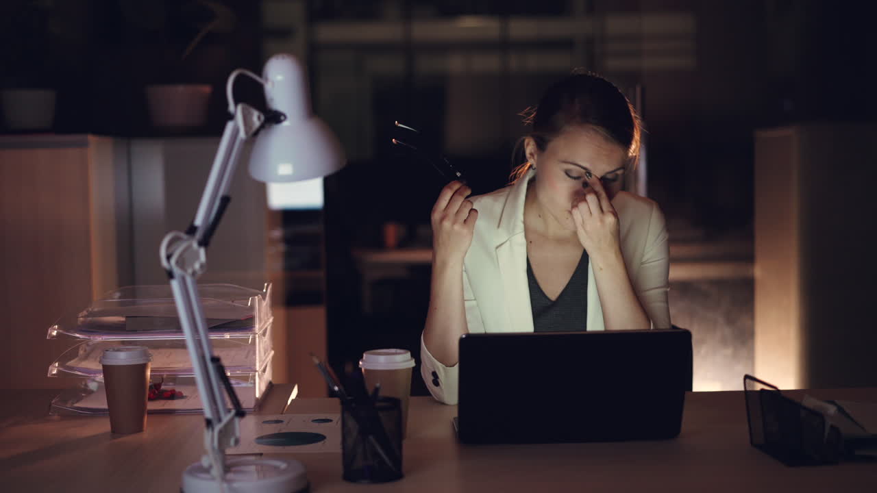 Businesswoman Working Late at Night in Office