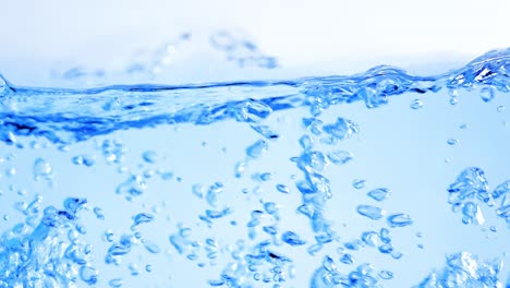 many bubbles in water close up, abstract water wave with bubbles in slow motion