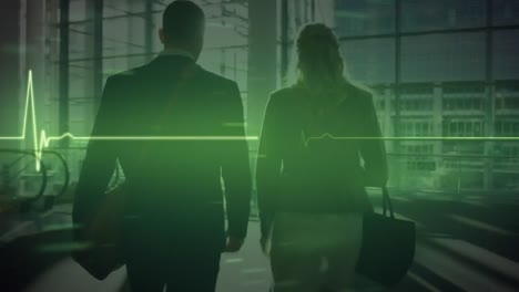 animation of glowing green heart rate monitor and data, over couple walking in modern building