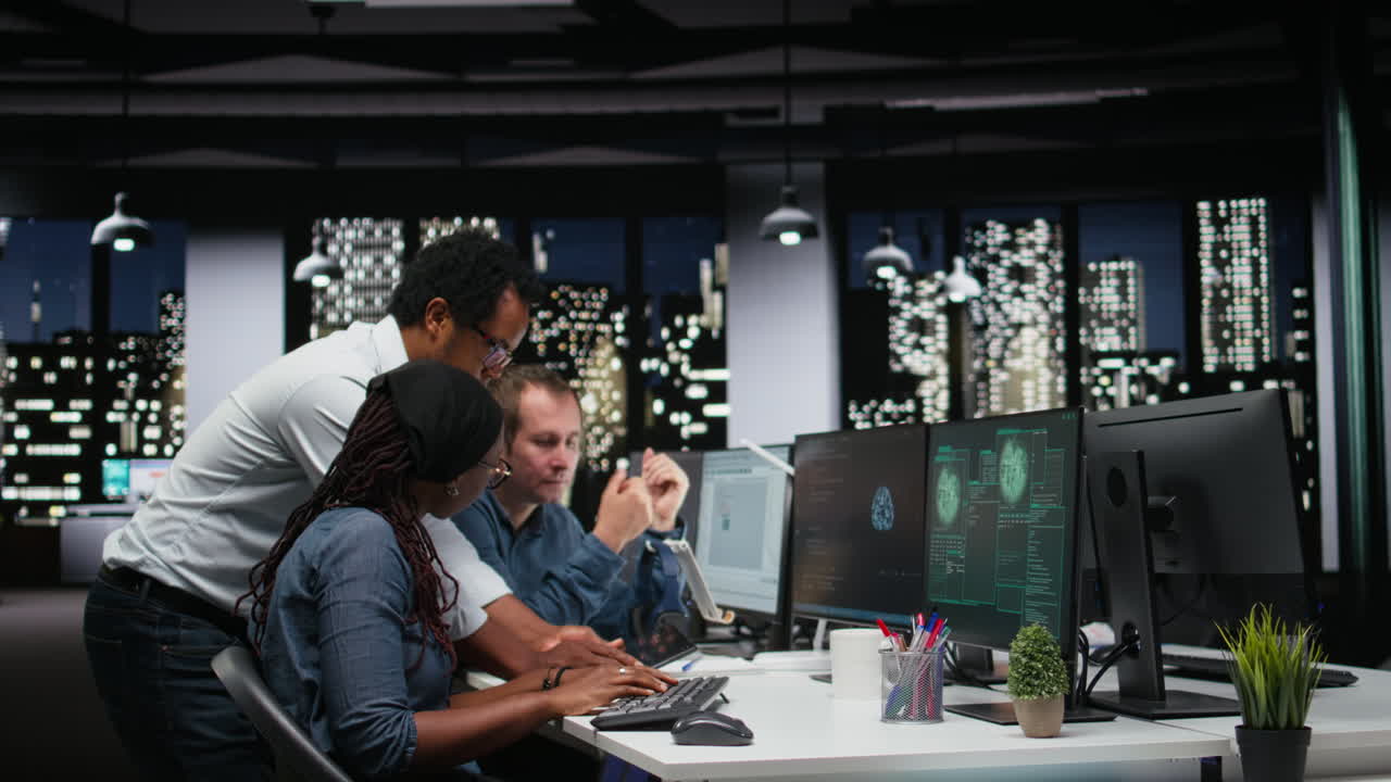 IT Professionals React to System Hacked Alert on Computer Screen