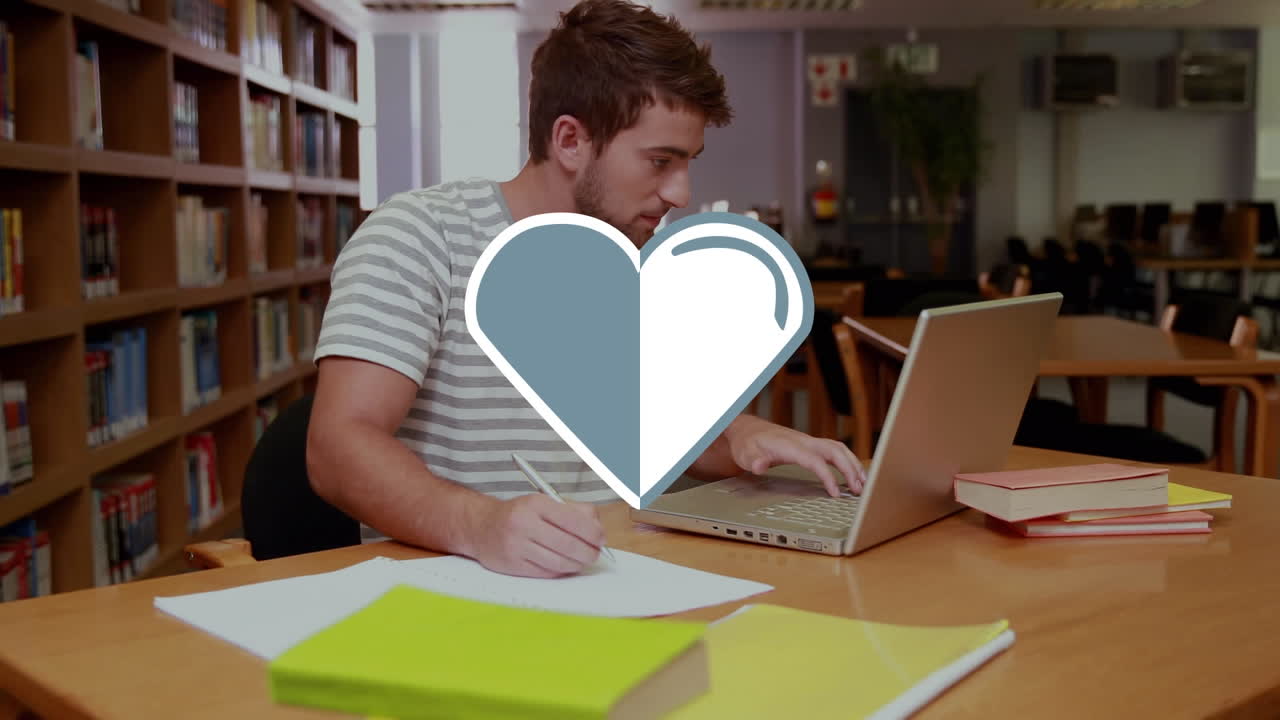 la animación del corazón sobre la escritura del estudiante caucásico masculino.
