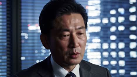 business executive discusses future strategies in a high-rise office at night