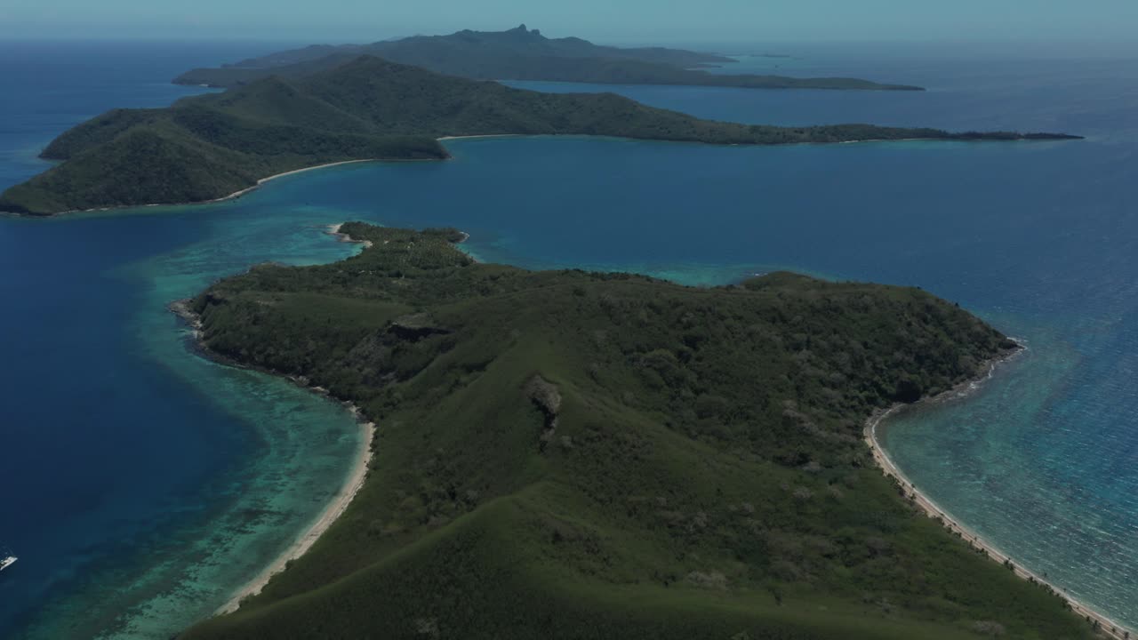 Flying over the beautiful green Fiji mountain islands
