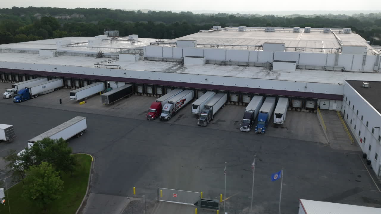 Aerial View of Semi-Trucks Parked at Different Stations at Warehouse Loading Bay