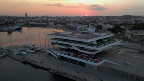 aerial view of emblematic la marítima de veles e vents restaurant in valencia during sunset, spain