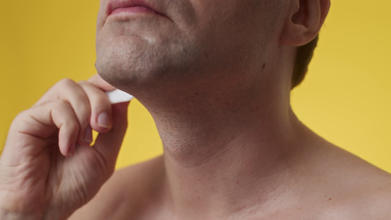 Male Adult Doing Neck Massage with Gua Sha